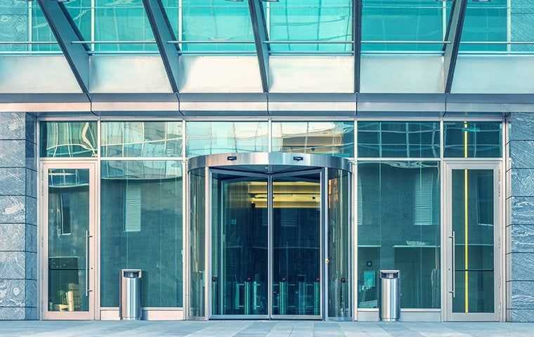Revolving door entrance to a large commercial building with offices in New York
